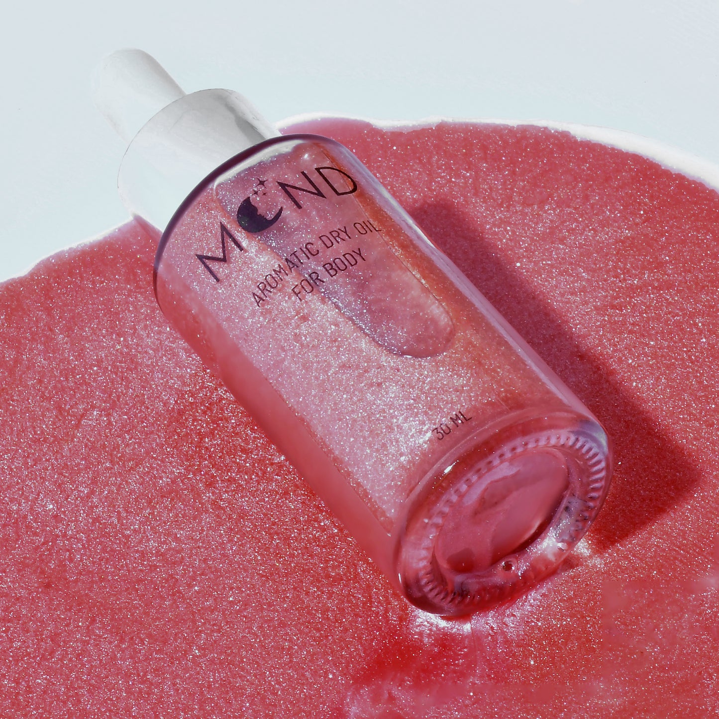 Pink shimmering dry oil