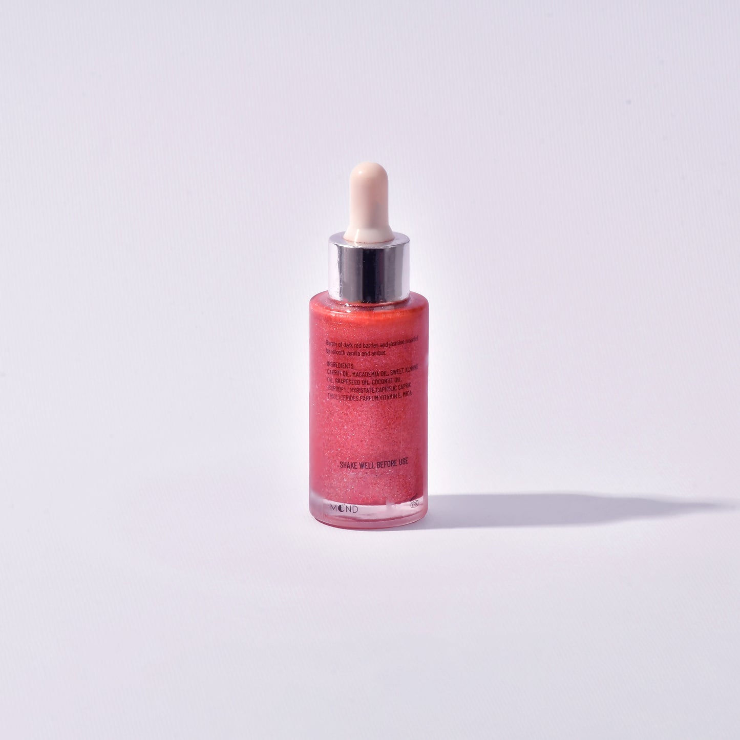 Pink shimmering dry oil
