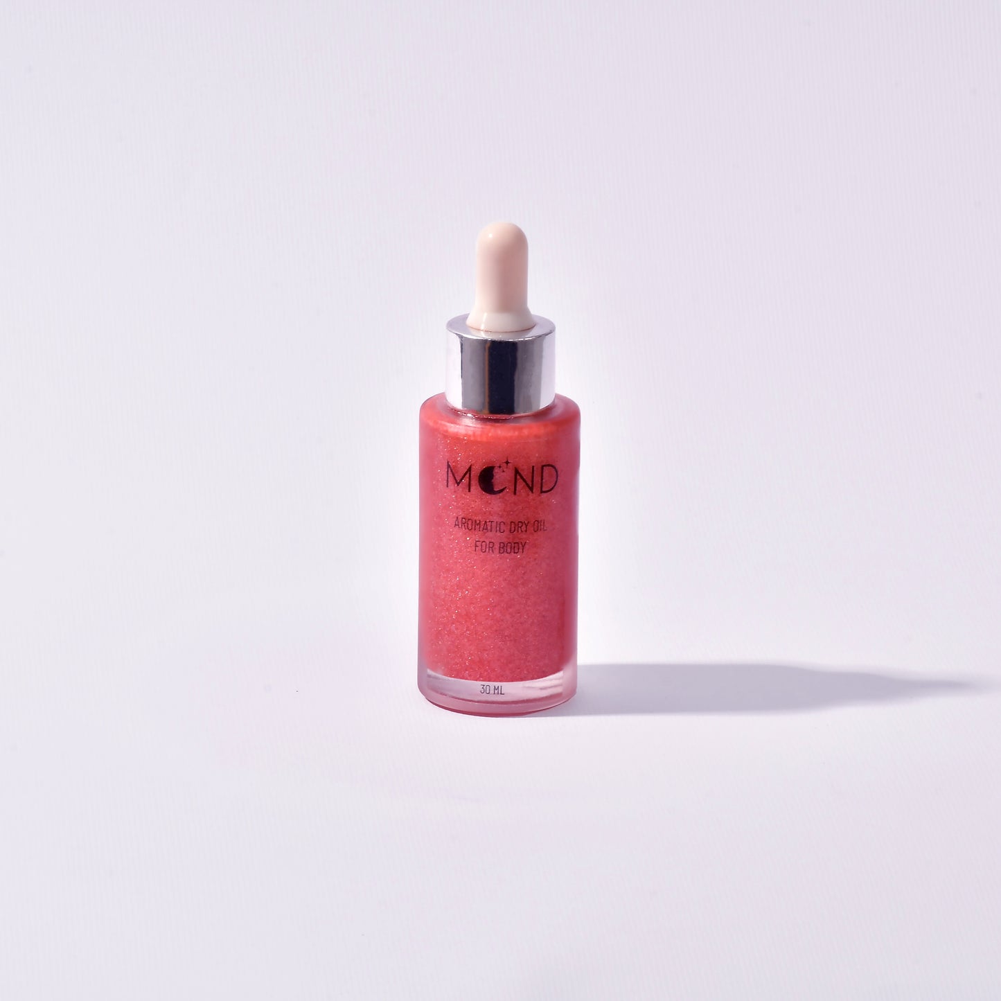 Pink shimmering dry oil