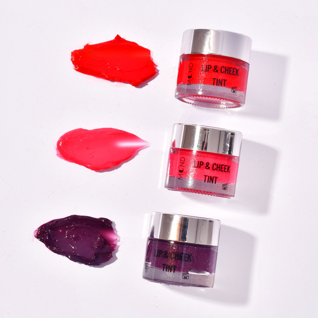 Three lip tint containers with their respective colors on a white background
